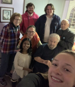 Keith at home with his family for Thanksgiving: in the group are his mother-in-law; his two sons; a family friend; his wife, Jean, and two daughters, Priya and Sarah