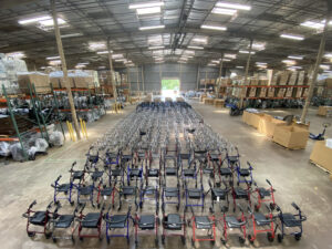 Rows of walkers streatching out to the end of a large warehouse