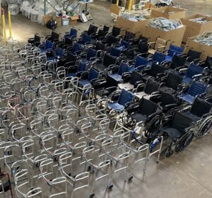 Image of walkers and wheelchairs lined up in a warehouse in MD, USA.