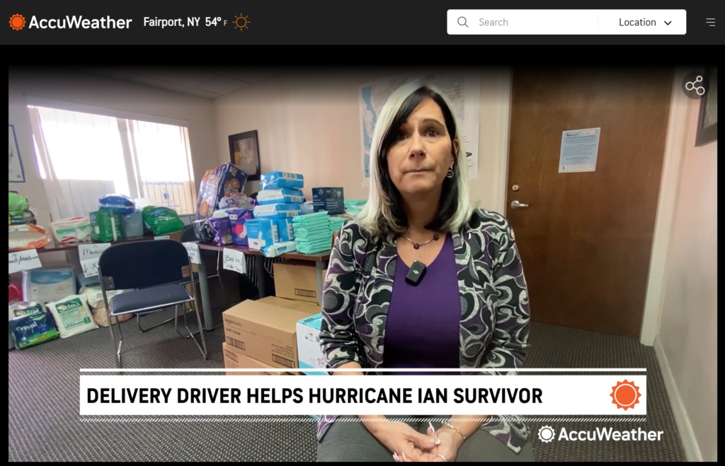 A screenshot from AccuWeather online, with a woman standing and speaking to the camera; the title below her says "Delivery driver helps Hurricane Ian survivor."