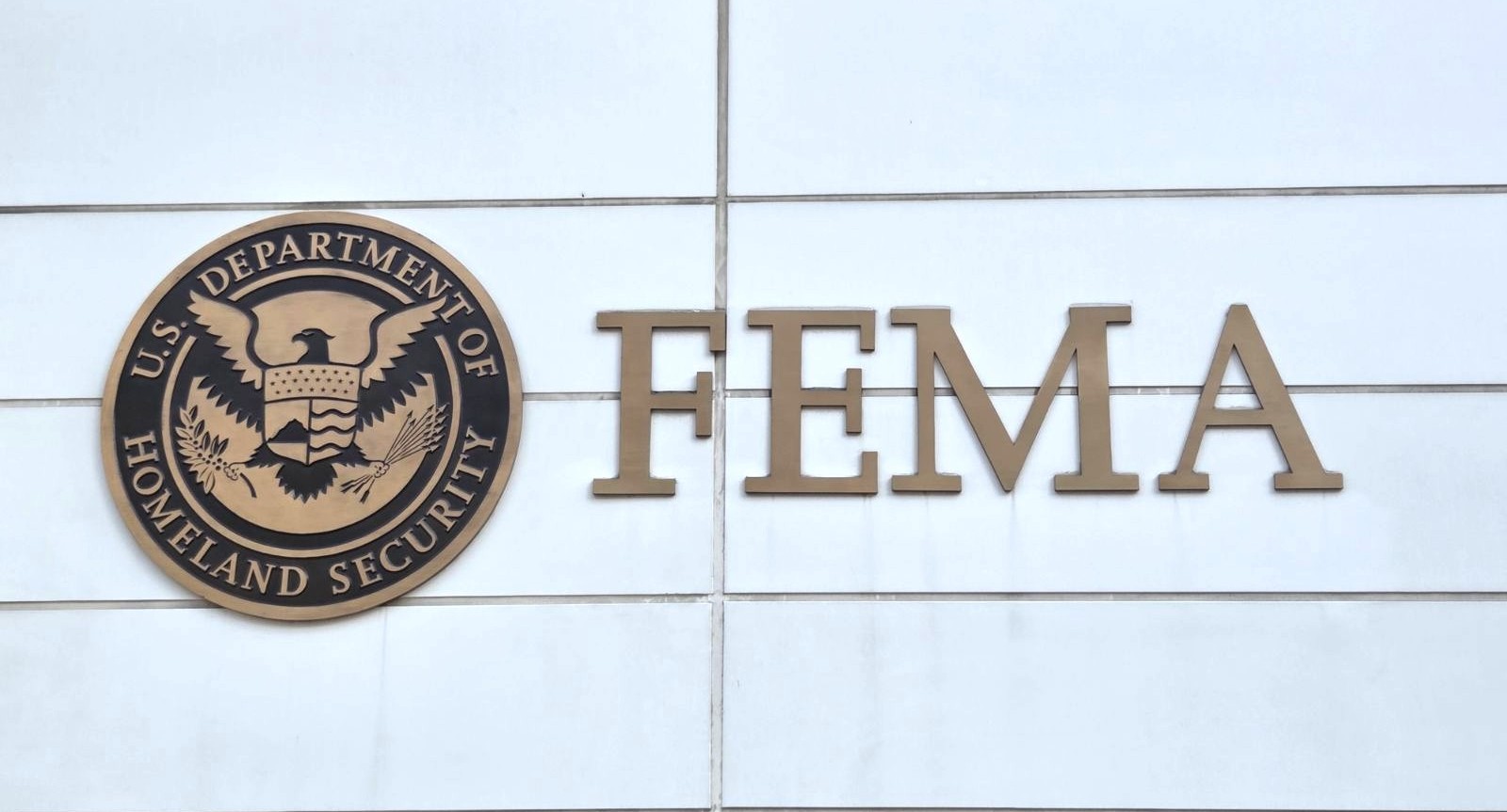 Image of the Department of Homeland Security logo and the word FEMA on a building.